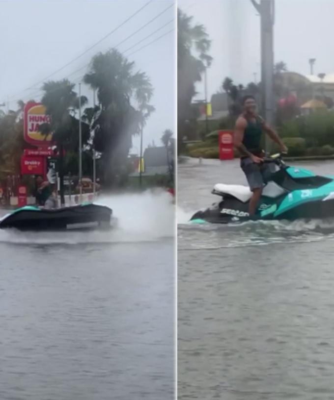 Man Filmed Riding A Jet Ski To Maccas After Heavy Rain Causes